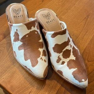 Cow design ladies mules, white and tan. Size 6.  Worn twice.  Great condition.